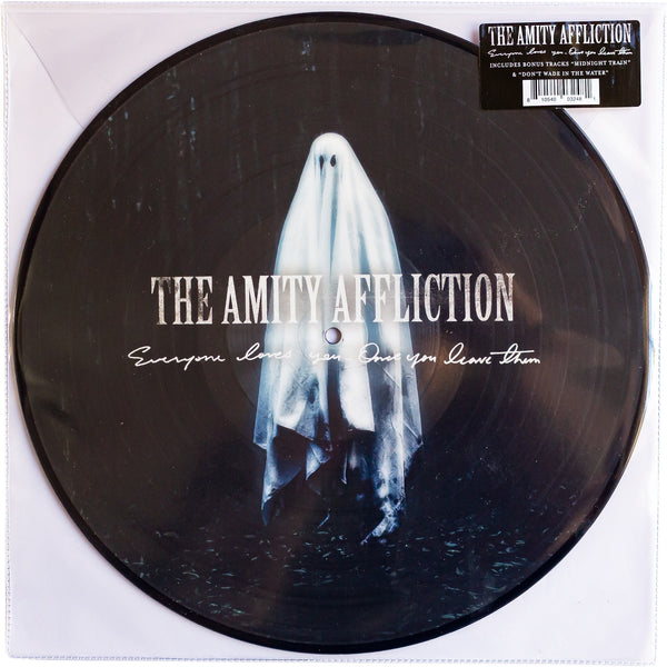 Image of a black picture disk vinyl in a clear sleeve against a white background. The vinyl artwork features a ghost in a dark forest at night. The ghost is floating in the center of the artwork. Across the center of the ghost in white letters it says the amity affliction. below that in smaller white cursive it says everyone loves you... once you leave them. There is a black hype sticker on the top right of the picture disk on the clear sleeve that also says the bands band and album title in white.