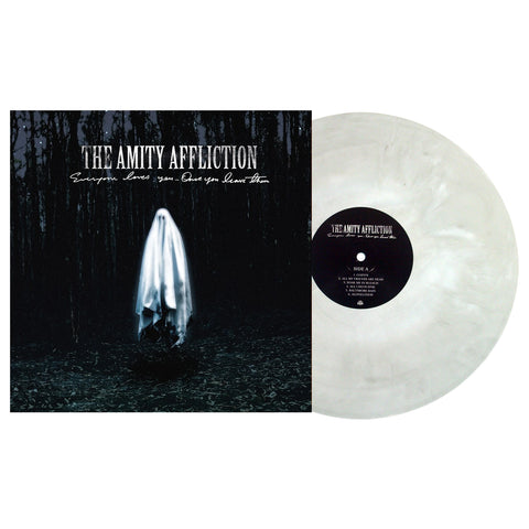 Image of a vinyl sleeve with a grey and white mixed vinyl coming out of the sleeve against a white background. The artwork on the sleeve is a ghost in a dark forest at night, with stars showing through the trees. The ghost is floating in the center. Above its head in white letters it says the amity affliction. below that in smaller white cursive it says everyone loves you... once you leave them. 