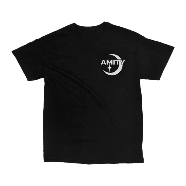 Image of the front of a black tshirt against a white background. The left chest of the shirt says Amity in white text and behind it is an image of a crescent moon. Below the M in amity is a small white star.