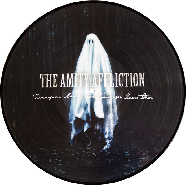 Image of a black picture disk vinyl against a white background. The picture disk features the album artwork of the amity affliction, everyone loves you... once you leave them album. The artwork features a ghost in a dark forest at night. The ghost is floating in the center of the artwork. Across the center of the ghost in white letters it says the amity affliction. below that in smaller white cursive it says everyone loves you... once you leave them.