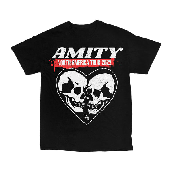 image of the front of a black tee shirt on a white background. the tee he tee has a full chest print of a heart with two skulls inside. across the top says amity north american tour 2022.