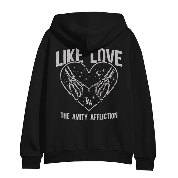 Image of the back of a hooded sweatshirt against a white background. Across the shoulder area in white bold text it says Like love. Below that is an image of a white outline heart filled with stars and a small crescent moon. Two skeleton hands holding pinky fingers are also inside the heart. Below the hands it says TAA. Below the heart in white text it says the amity affliction. The entire design is in white.